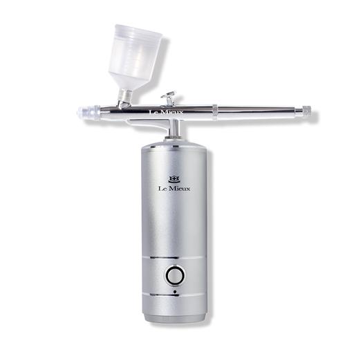 Ionized Oxygen Infuser with a silver base, silver fine mist spray nozzle, and clear plastic serum reservoir.