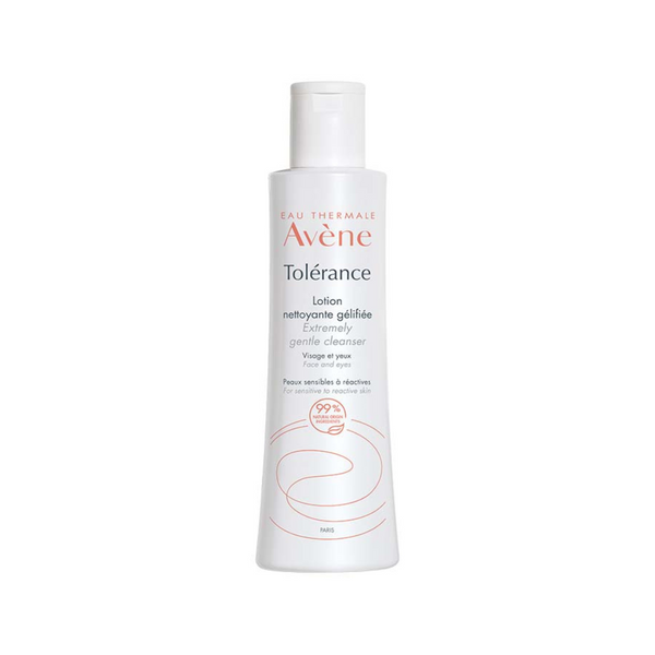 Avène Tolérance Extremely Gentle Cleanser in a tall, white, stylized bottle with flip cap lid.