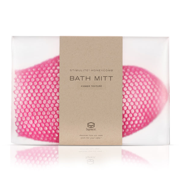 Pink Supracor Stimulite Bath Mitt with honeycomb texture inside a clear plastic box packaging.