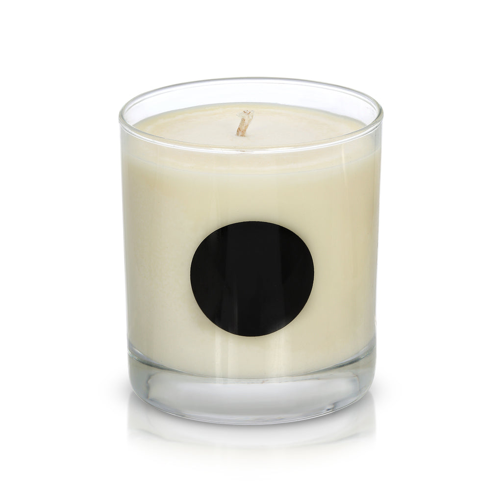Black Ball Candle in a Clear Whiskey Glass with Black Dot at Center of Glass Container