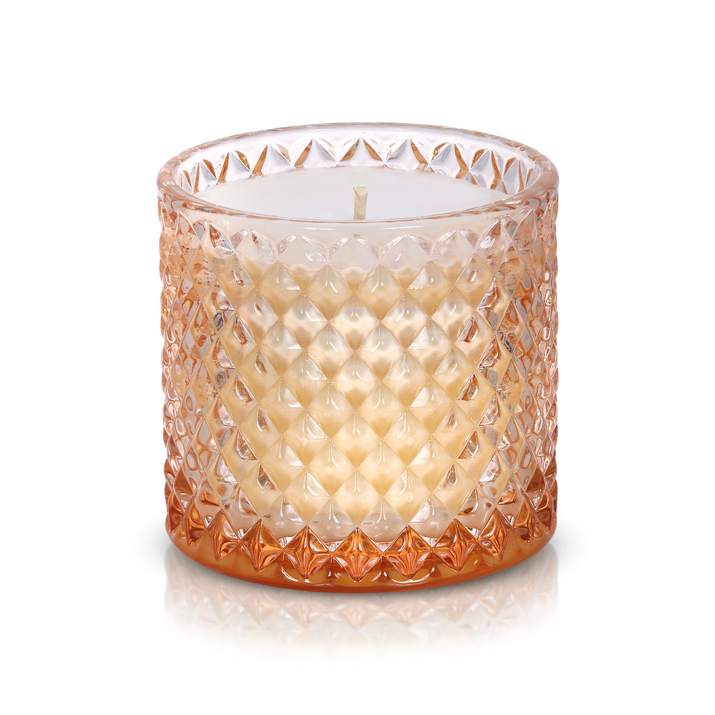 The Perfect Blend of Fig Candle in peach tinted diamond patterned glass without lid.