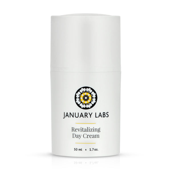 Revitalizing Day Cream in white bottle with white cap.